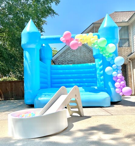 Pastel Blue Bounce House with Balloon Garland & Ball Pit