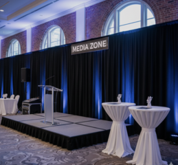 100 Person Corporate Seating with Stage Setup