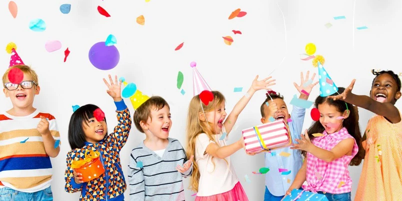 Children celebrating birthday party together