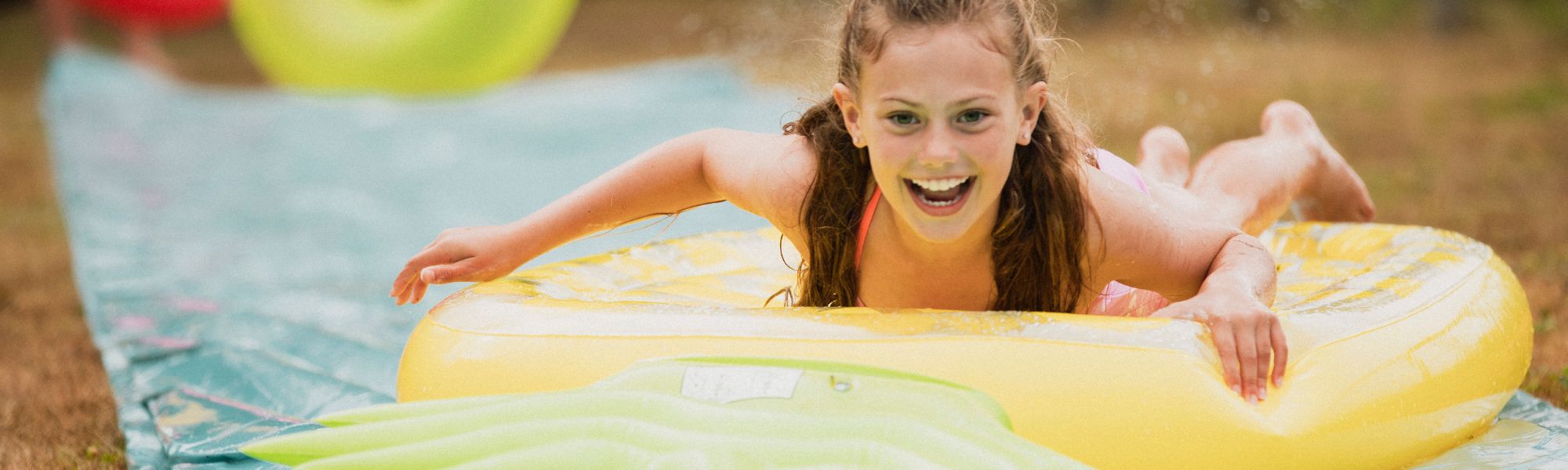 kid enjoying the water slide