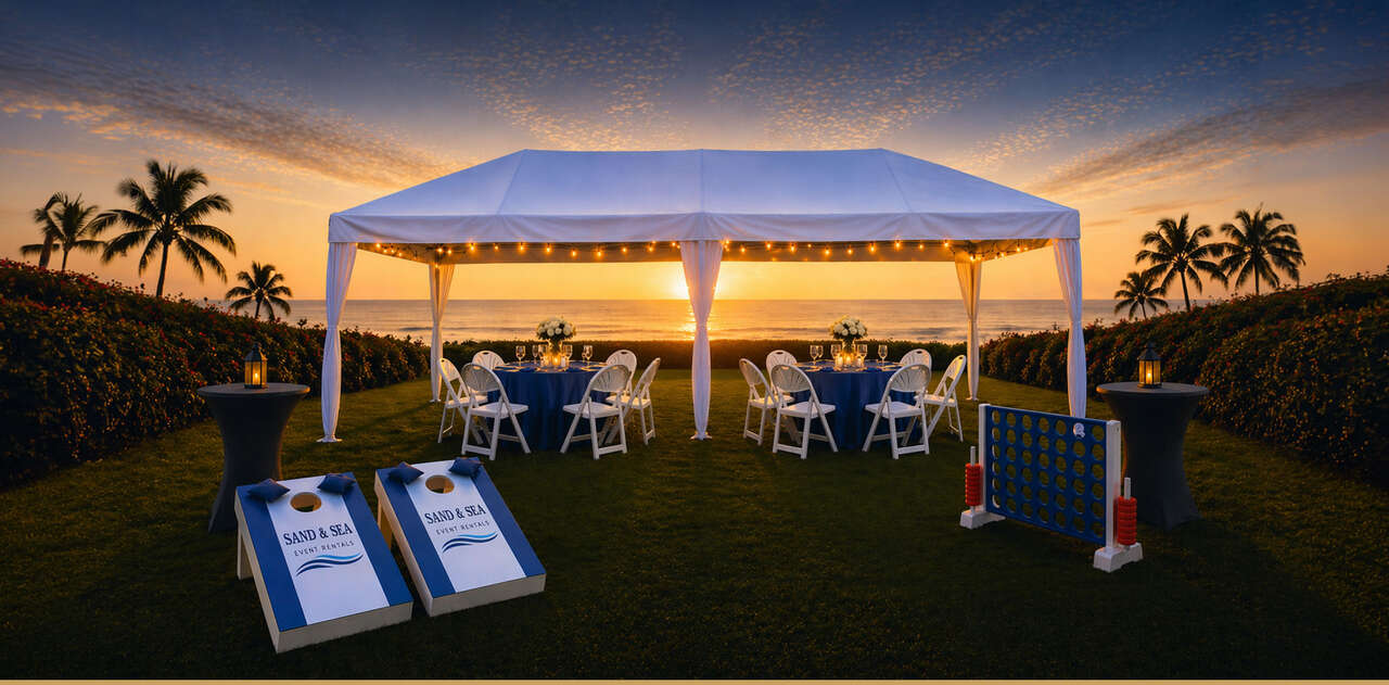Elegant outdoor event setup with tent, tables, chairs, and yard games at sunset in Virginia Beach