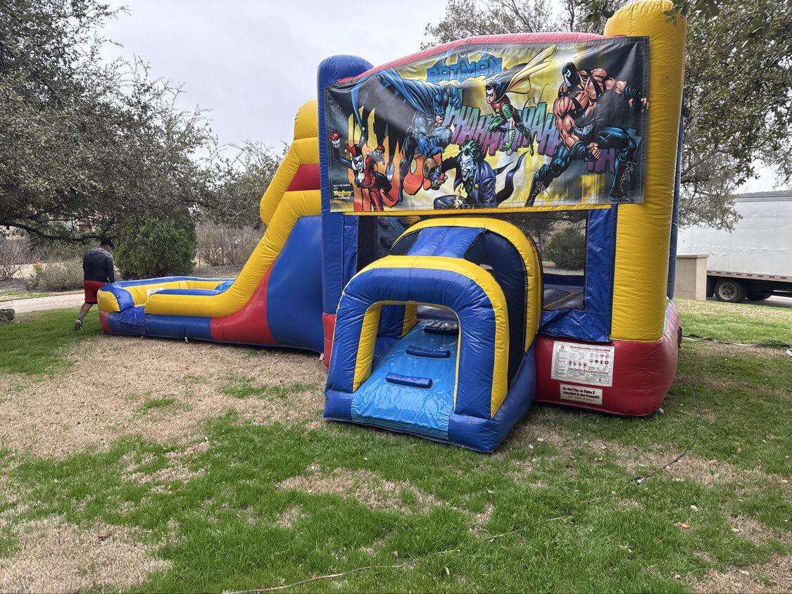 Batman combo bounce house with slide from Sandi's Moonwalks.