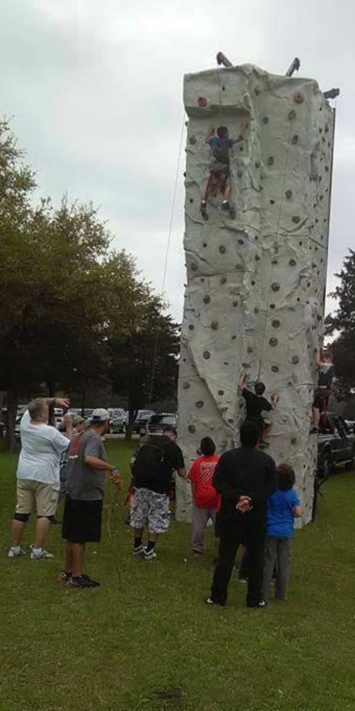 Showcase Entertainment mobile rock climbing wall with climbers.