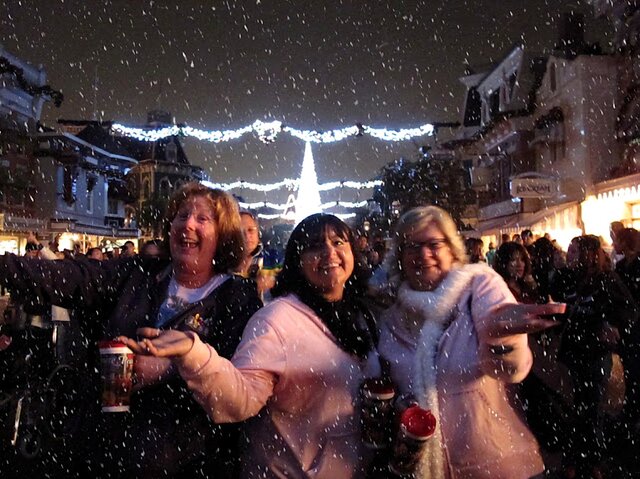 Friends laughing in an evening snowfall in Collegedale, TN