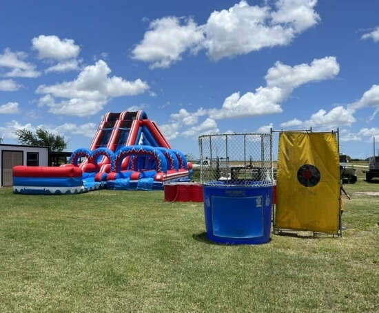 Dunk tank and inflatable rental setup from Sky High Rentals for outdoor parties 