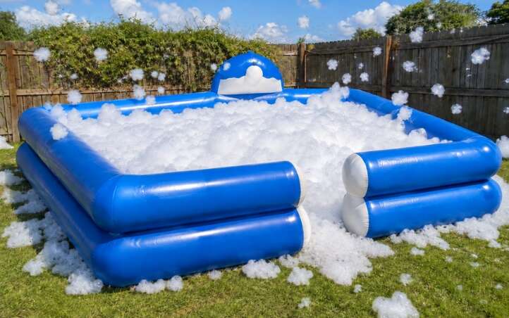 Kids playing in foam at a foam party rental in McAllen, TX