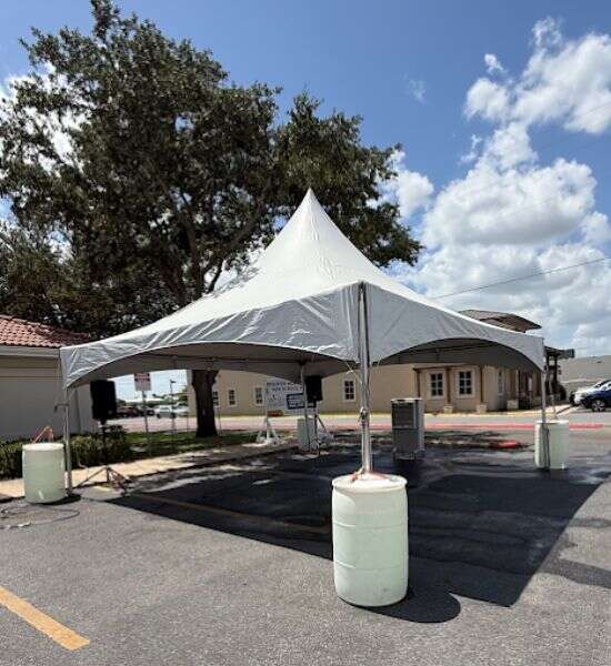 White outdoor tent rental setup by Sky High Rentals
