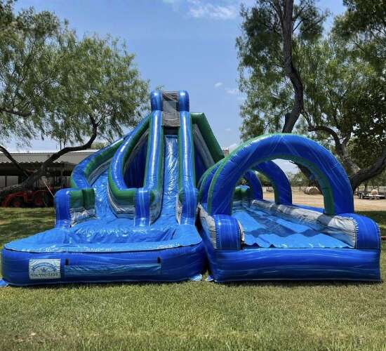Blue and green wave water slide rental in McAllen, TX from Sky High Rentals