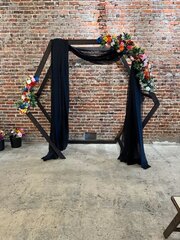 Wood Octagon Arch with Flower Swags and Black Draping