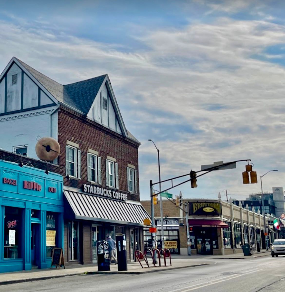 Urban corner with Starbucks and local shops