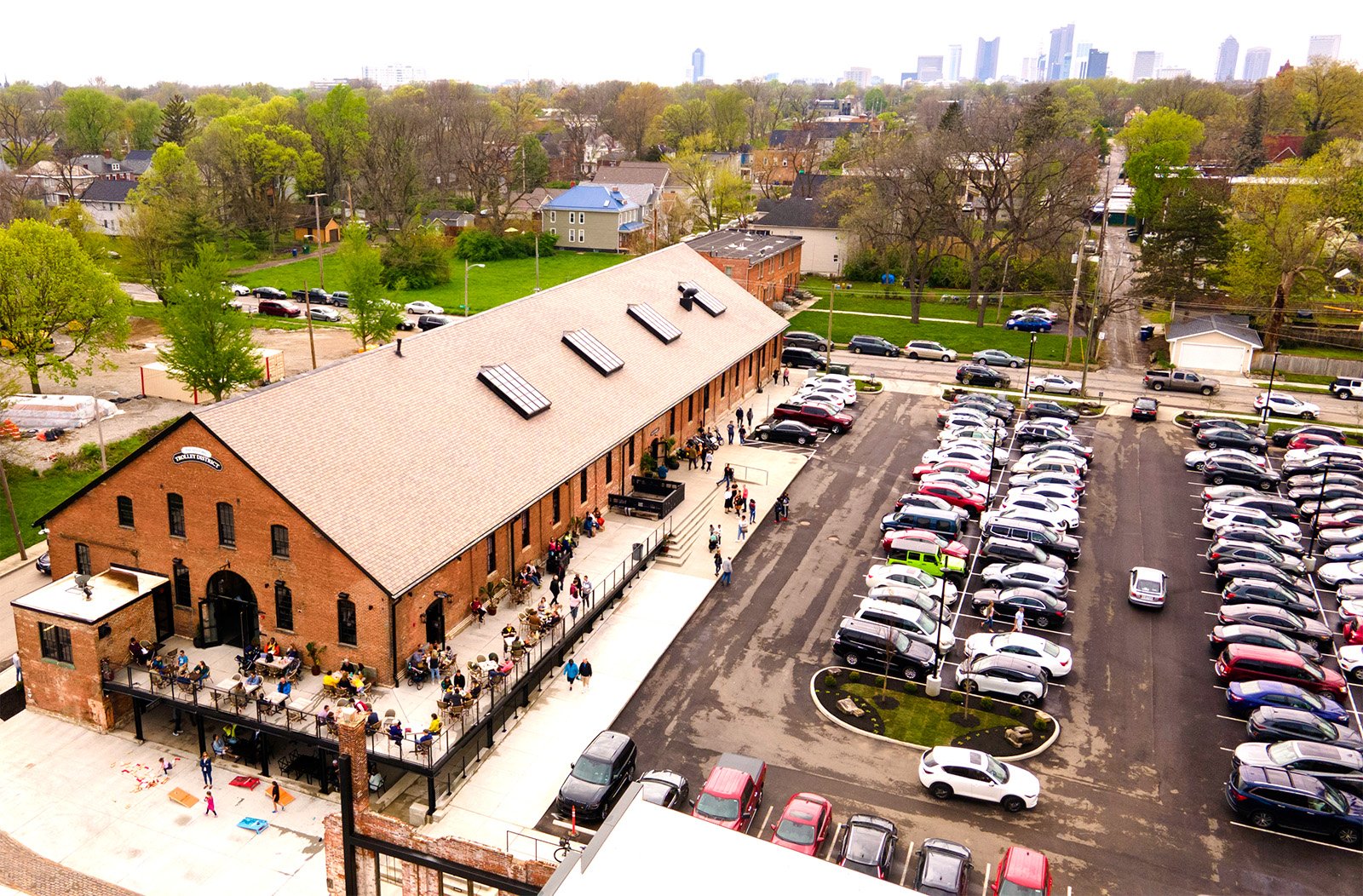 Aerial view of public market with large parking lot