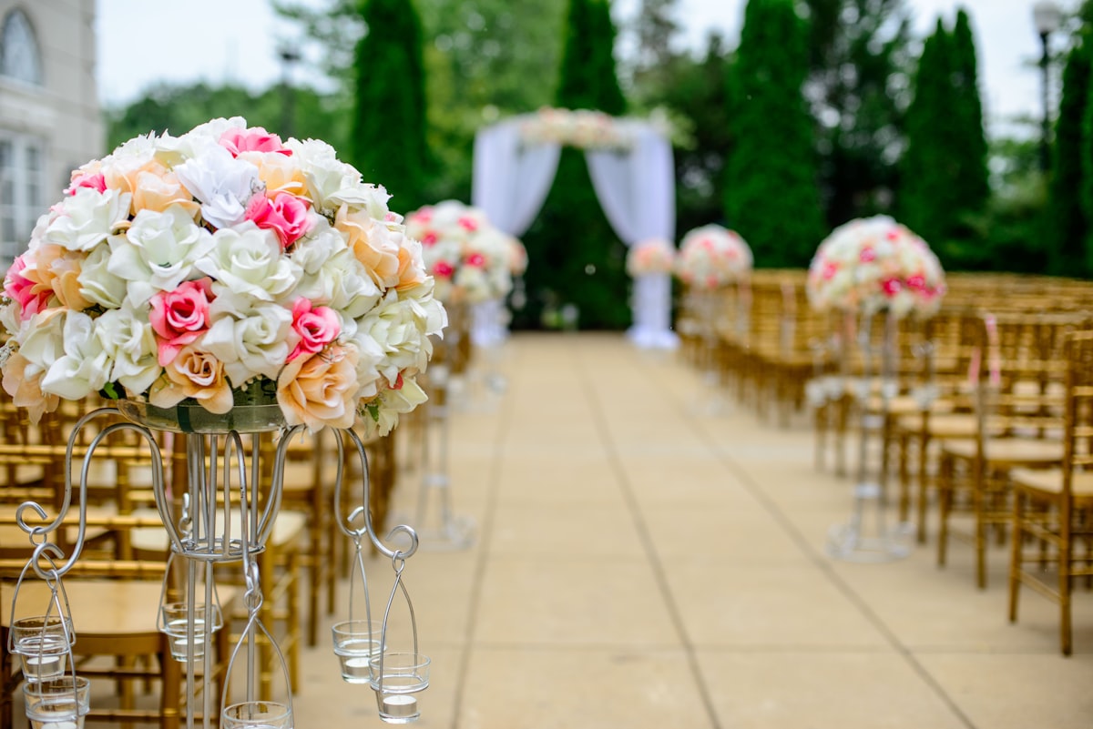 outdoor ceremony setup with floral aisle and draped arch near Grand Rapids
