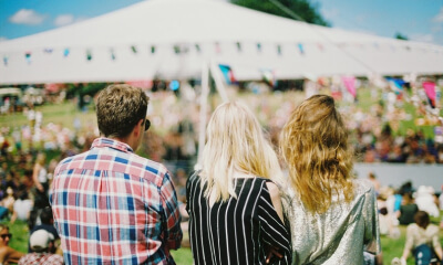 guests at an outdoor tented venue