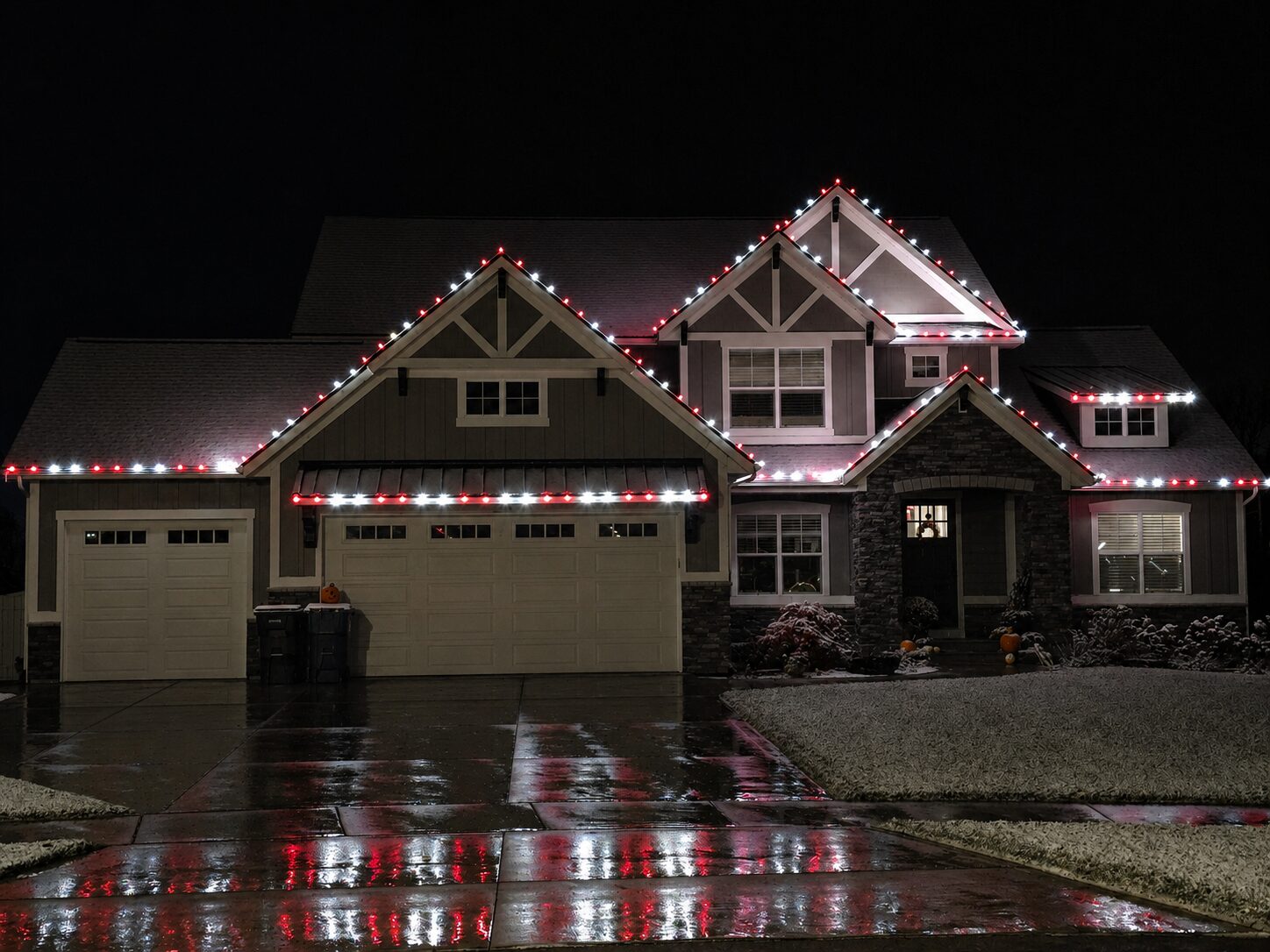 Red and cool white Christmas lights on a Grand Rapids area home