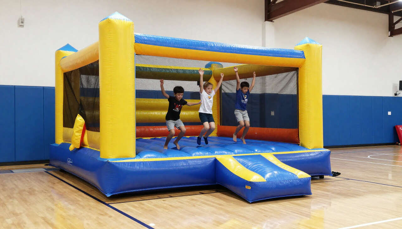 Kids enjoying indoor bounce house rental in Plano TX