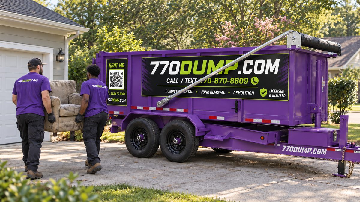 770dump crew loading a sofa into a purple dumpster
