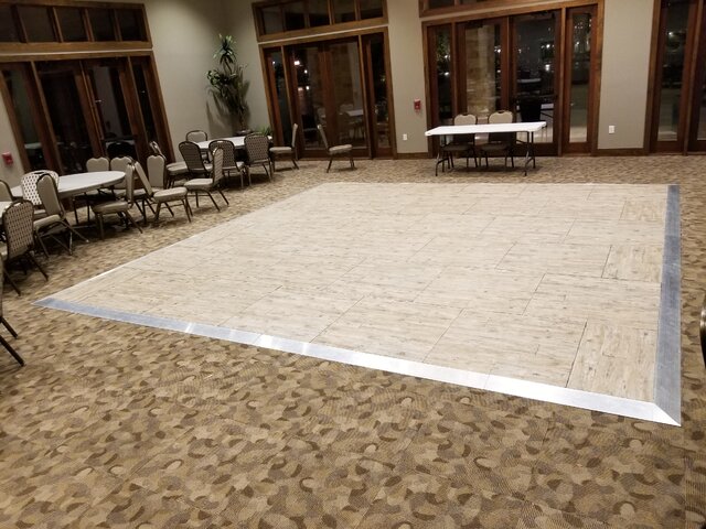 Wood parquet dance floor set up at an indoor venue