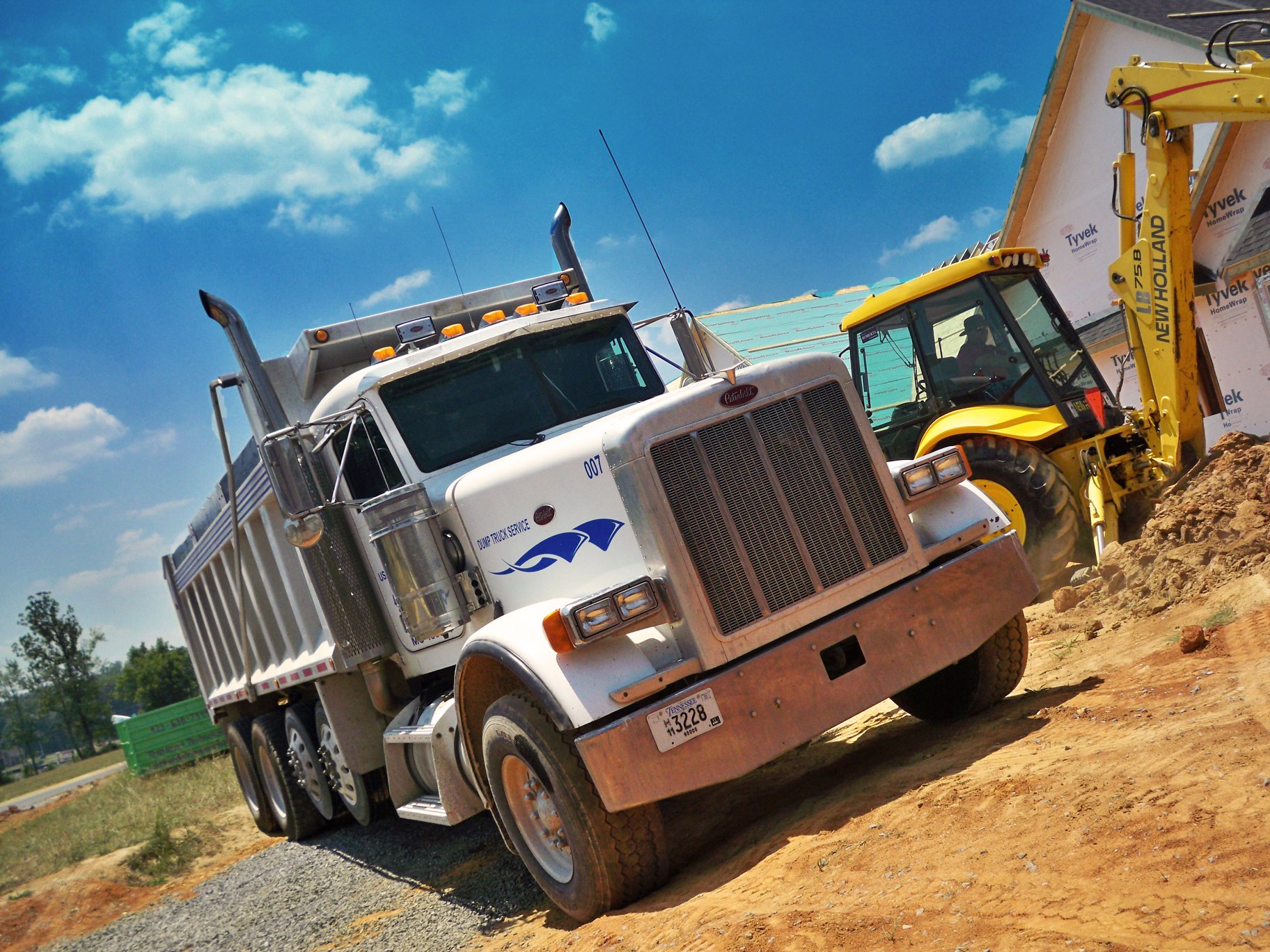 Dumpster truck at a construction site Dumpster truck at a construction site