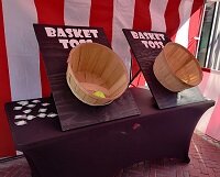 Just like on the Midway, Basket Toss.
An Old School Carnival game.
Starting. . . 