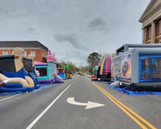 UBOUNCE Party Rentals inflatable bounce houses and slides lined up