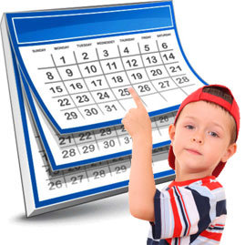 Boy pointing to a calender