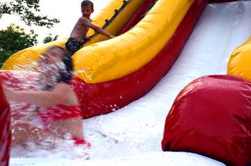 girl sliding down water slide