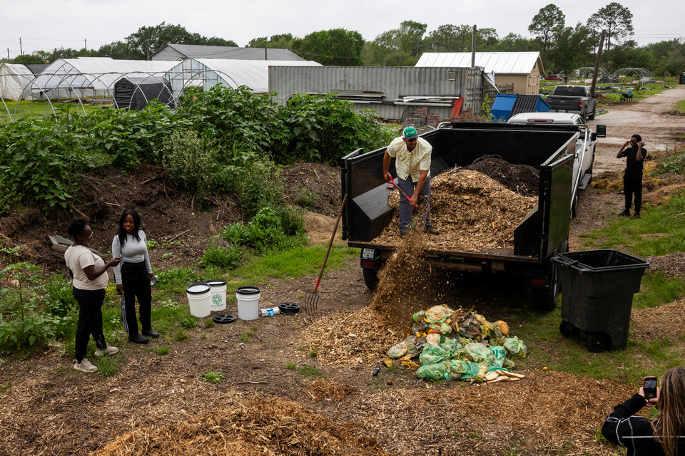 Agricultural site with workers generating organic and equipment waste