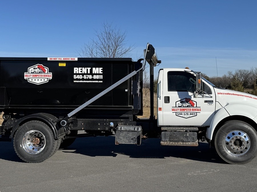 Valley Dumpster Rentals truck delivering a dumpster in Shenandoah Valley