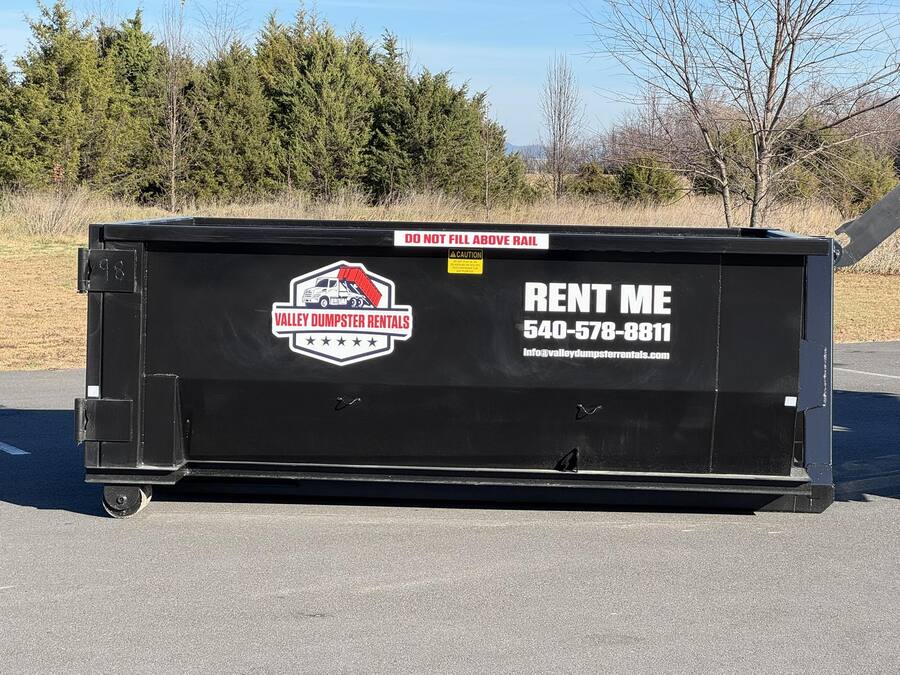 Roll-off dumpster rental placed on driveway by Valley Dumpster Rentals in Shenandoah Valley