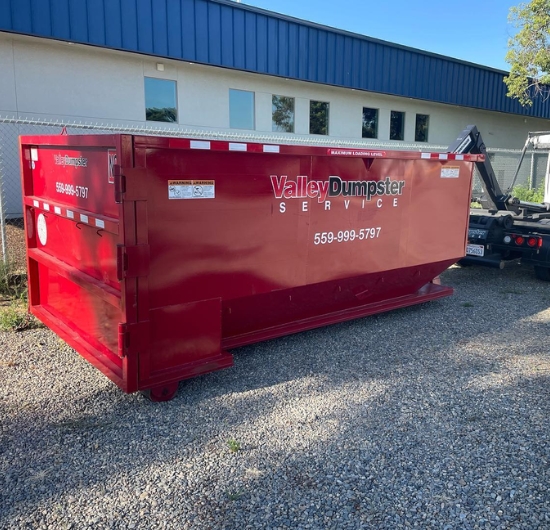 Red Valley Dumpster Service dumpster placed at commercial property for waste management