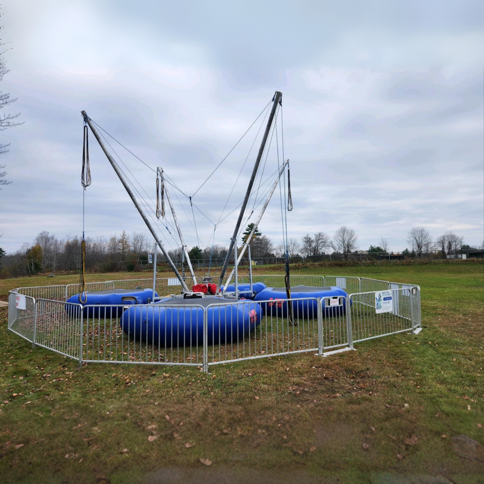 Vertical Entertainment bungee trampoline setup for an outdoor event. Vertical Entertainment bungee trampoline setup for an outdoor event.