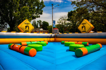 Inflatable wipeout challenge game setup by Vertical Entertainment.