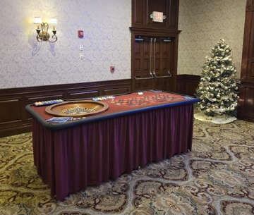 Vertical Entertainment Casino Night roulette table setup at indoor event venue