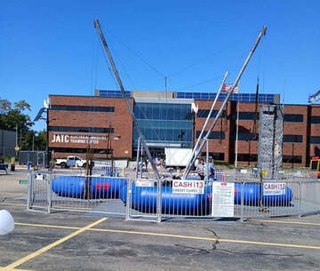 Vertical Entertainment portable rock climbing wall and bungee jump rental at outdoor event