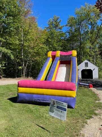 Vertical Entertainment portable rock climbing wall set up for outdoor event.