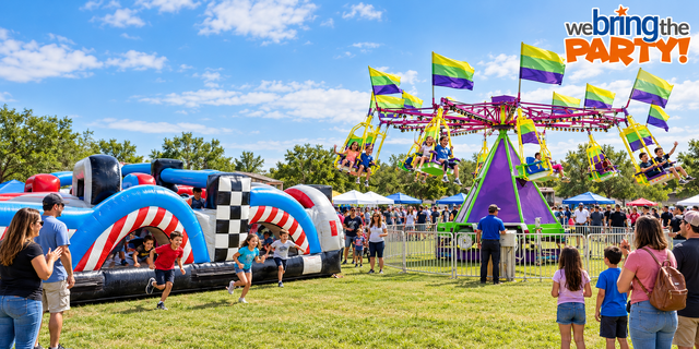 Inflatable obstacle course and swing carnival ride at a community festival