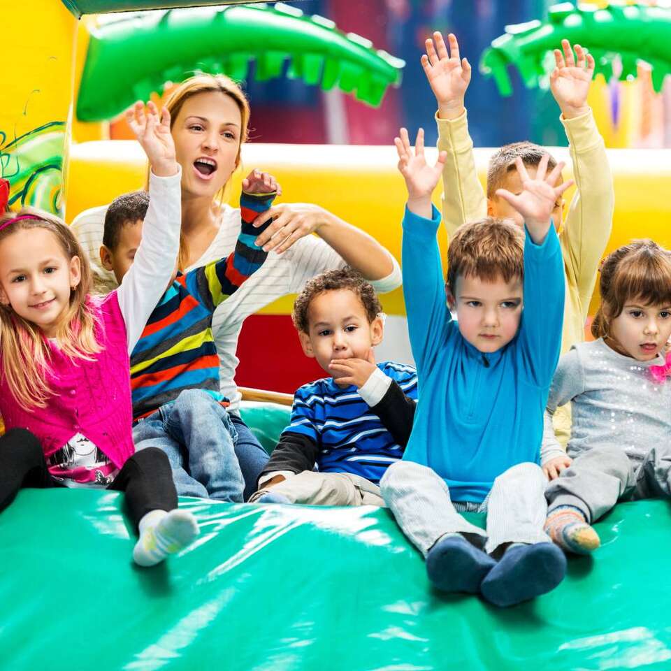 Inflatable Party Rentals from We Bring the Party in Austin, Texas showing kids playing on an inflatable obstacle course Inflatable Party Rentals from We Bring the Party in Austin, Texas showing kids playing on an inflatable obstacle course