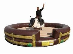 Western-style mechanical bull ride provided by We Bring the Party for parties and events. Western-style mechanical bull ride provided by We Bring the Party for parties and events.