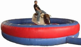 Mechanical bull ride setup by We Bring the Party for event entertainment. Mechanical bull ride setup by We Bring the Party for event entertainment.