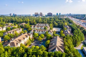 An aerial view of condos nearby the downtown Atlanta skyline