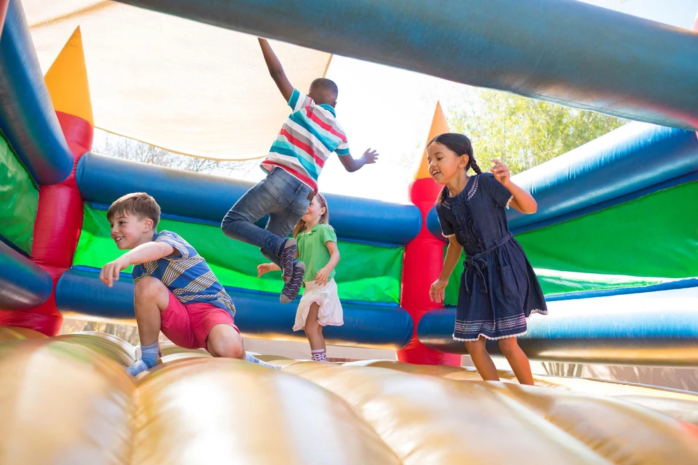 Children playing in an inflatable